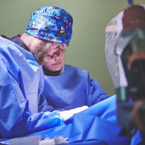 Veterinary surgeons wearing scrubs doing surgery