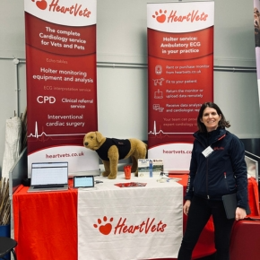 Cardiologist Joanna Harris at the 2025 Cornwall Veterinary Association CPD day with a table and posters promoting HeartVets